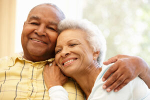Elderly couple smiling after Macular Degeneration Correction